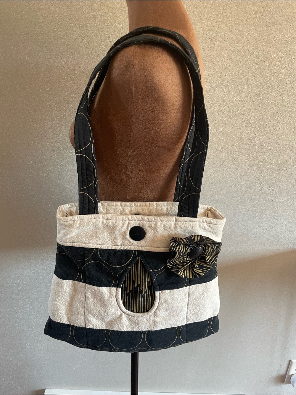 Striped Black and Cream Shoulder Bag with Decorative Bow Accent